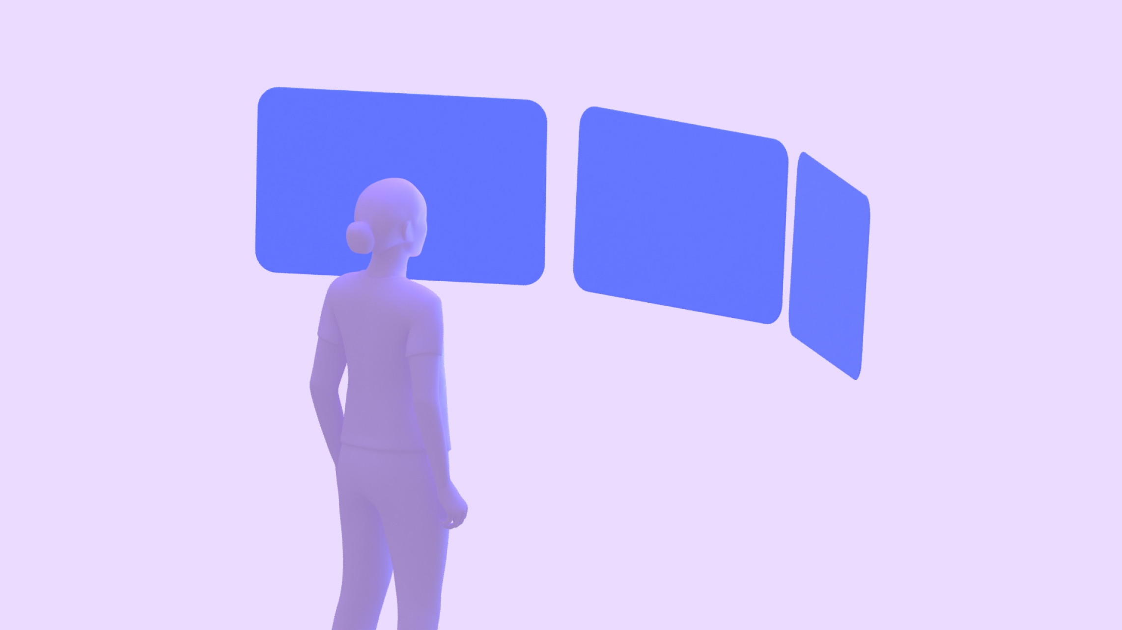 一个人正在看三个平板,它们并排排列在一个弯曲的排列中,右侧和左侧的外侧面板离他们更近