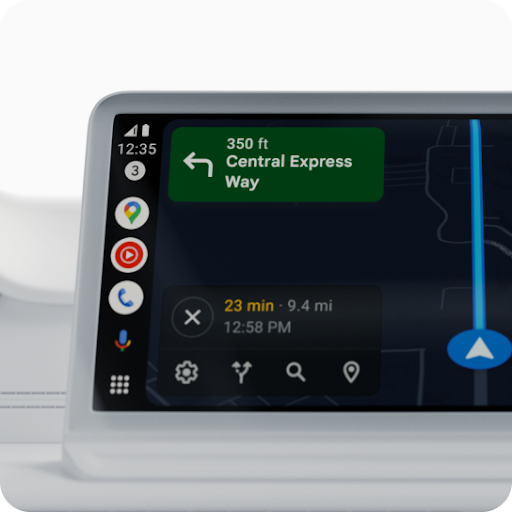 A black phone has “Android Auto” on its screen. Behind it is Google Maps on a car display.