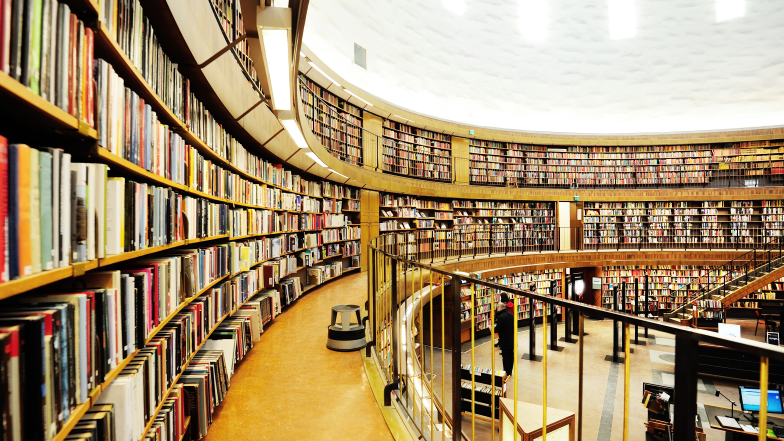 rounded bookcases and hallway on second floor of library